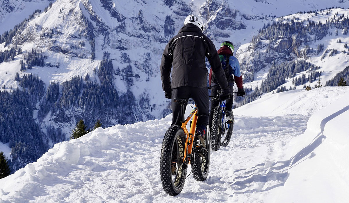 two bikers on winter trail