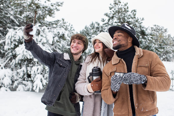 group of three people taking a selfie