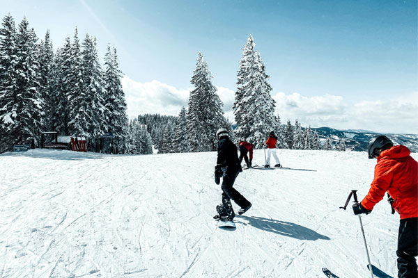 group of skiers and snowboarders