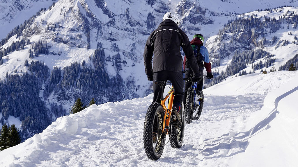 person riding bike in snow