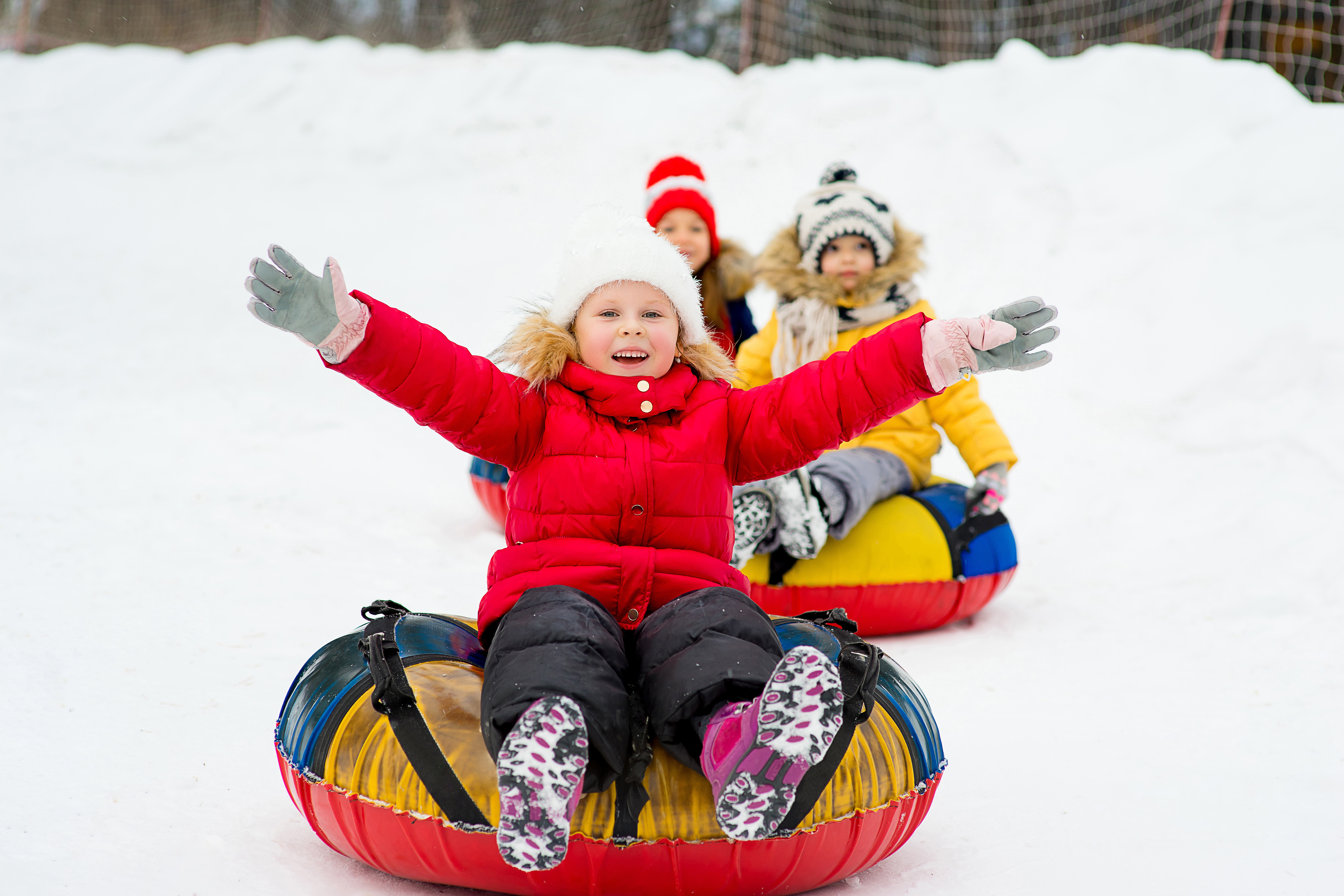 Kid snowtubing